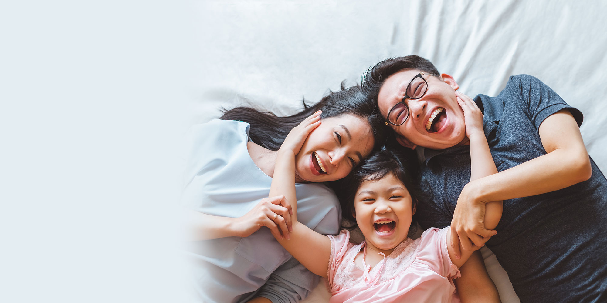 family smiling and laughing together